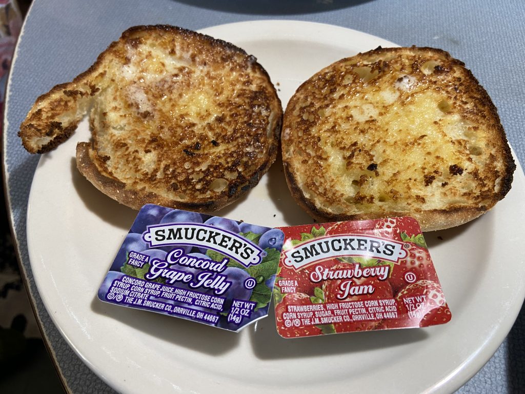 Waffle Shop toasted English muffins with Smucker's grape jelly and strawberry jam