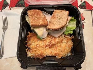 Denny's Cali Club sandwich with hash browns
