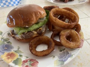 Kennedy's Pioneer Burger cheeseburger and onion rings
